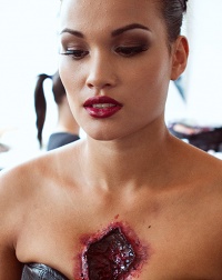 Chris Conway photographing model Emma Fellows, with special effects make-up by Amy Naughalty
