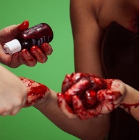 Chris Conway photographing model Emma Fellows, with special effects make-up by Amy Naughalty